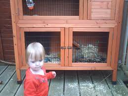 Baby standing in front of cabinet
